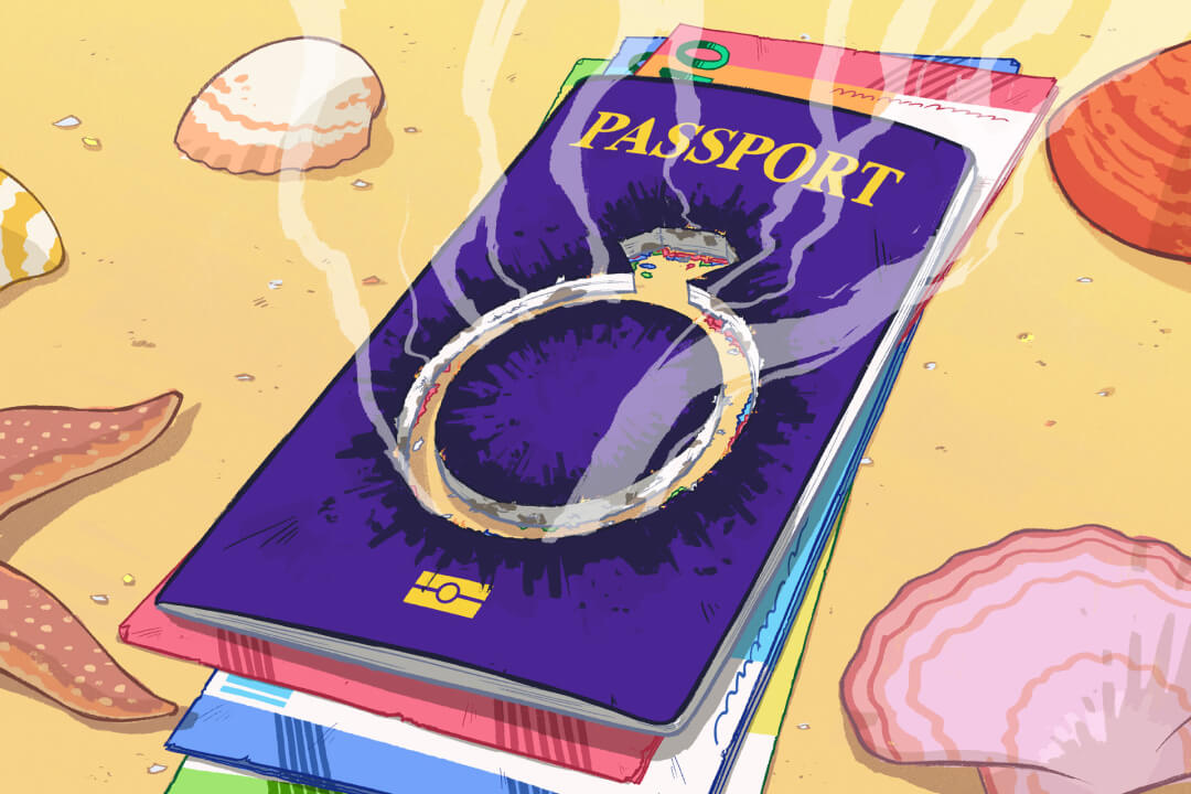 passport-with-ring-on-top-on-beach