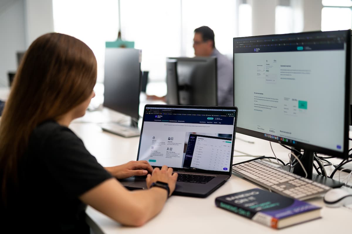 Engineer working at desk on laptop
