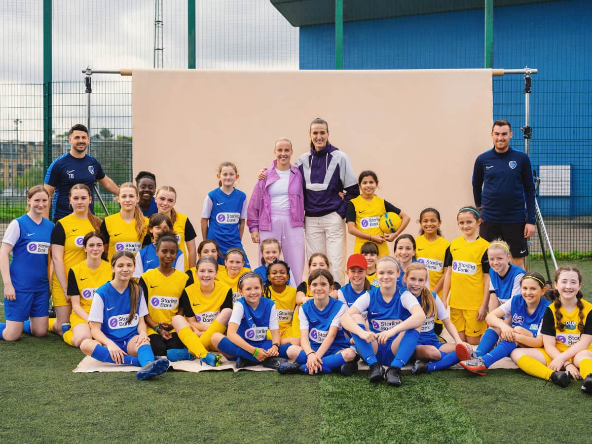 Taner Baycanli (standing, left), Beth Mead MBE and Jill Scott (standing, centre), and Vicky Park Rangers players