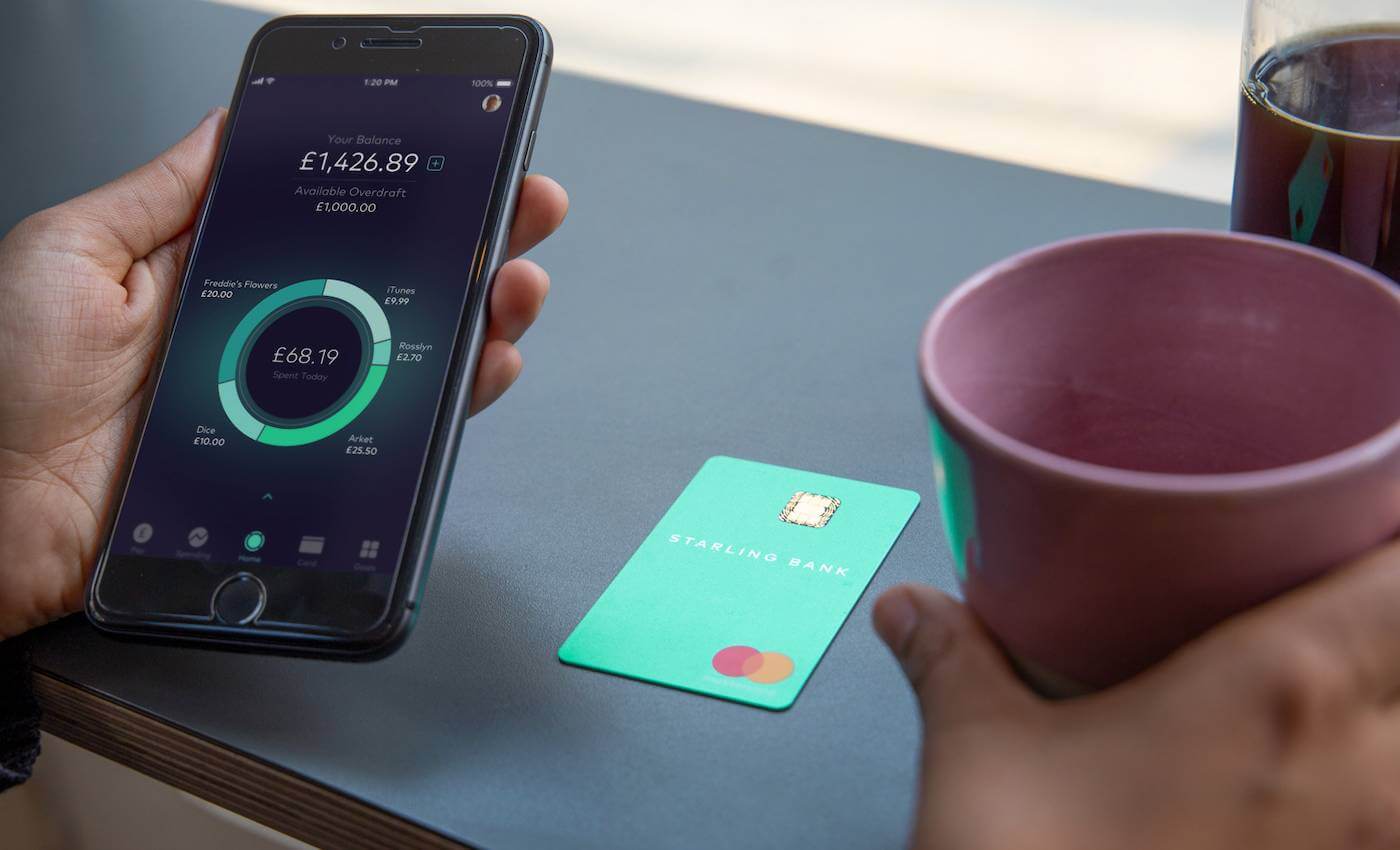 Phone with the app, and a Starling bank card