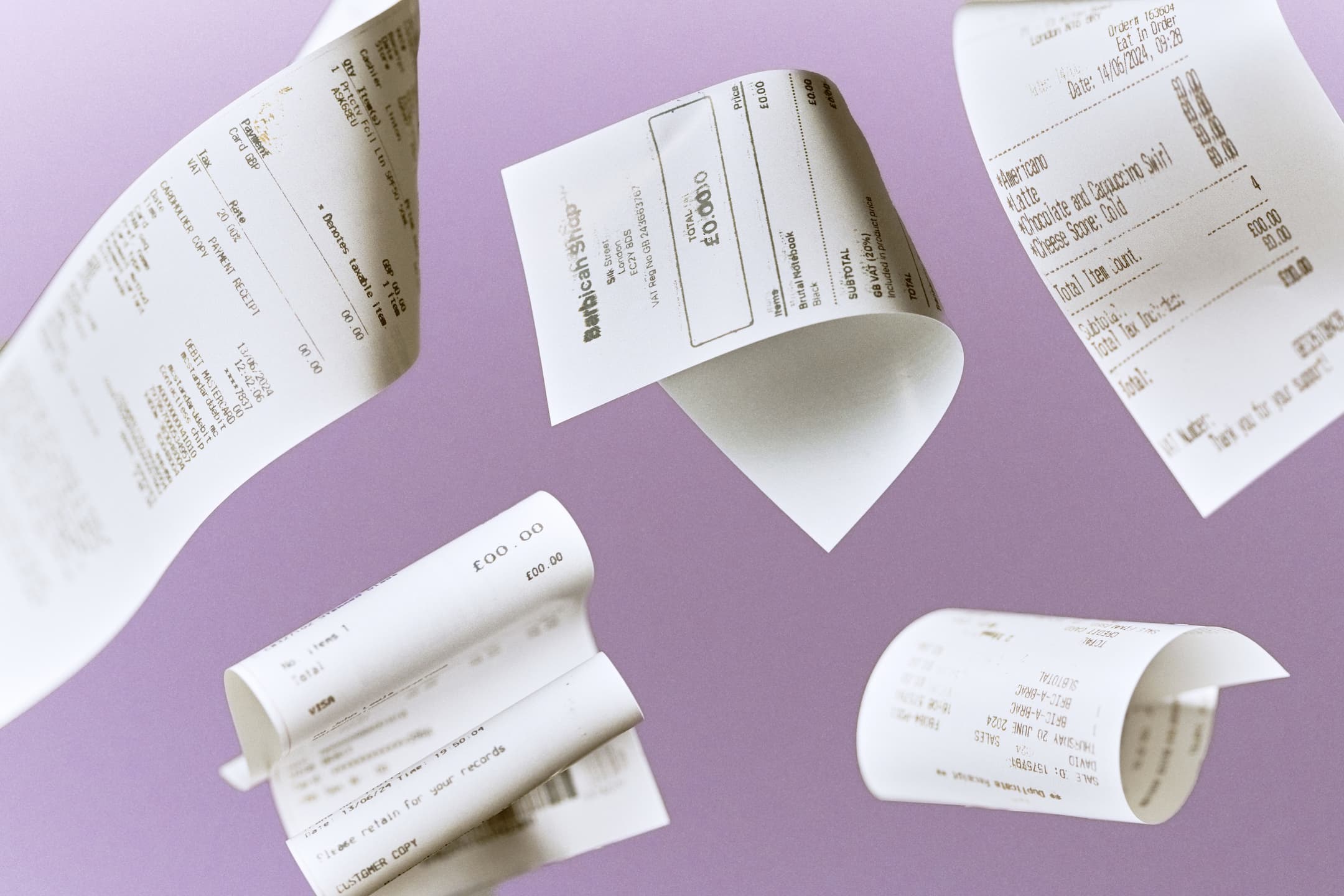 Multiple floating receipts with purple background