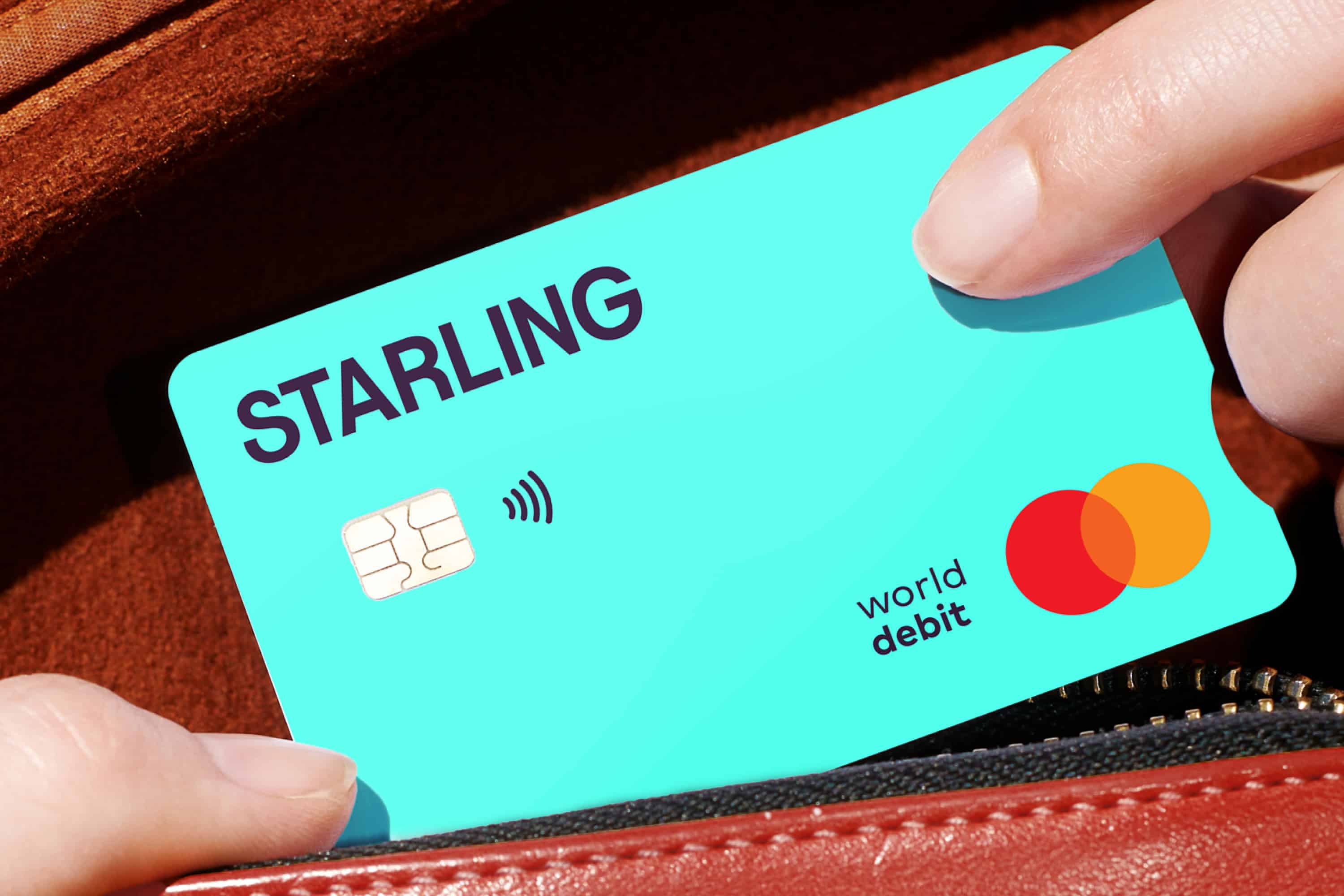 A person taking a Starling card out of their purse