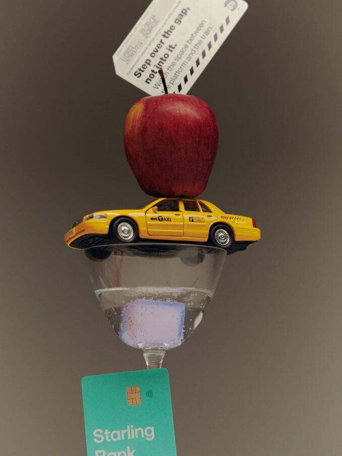 photo-of-subway-ticket-apple-toy-taxi-martini-glass-and-Starling-card