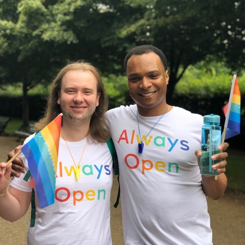 Oscar and Steve smile at Pride