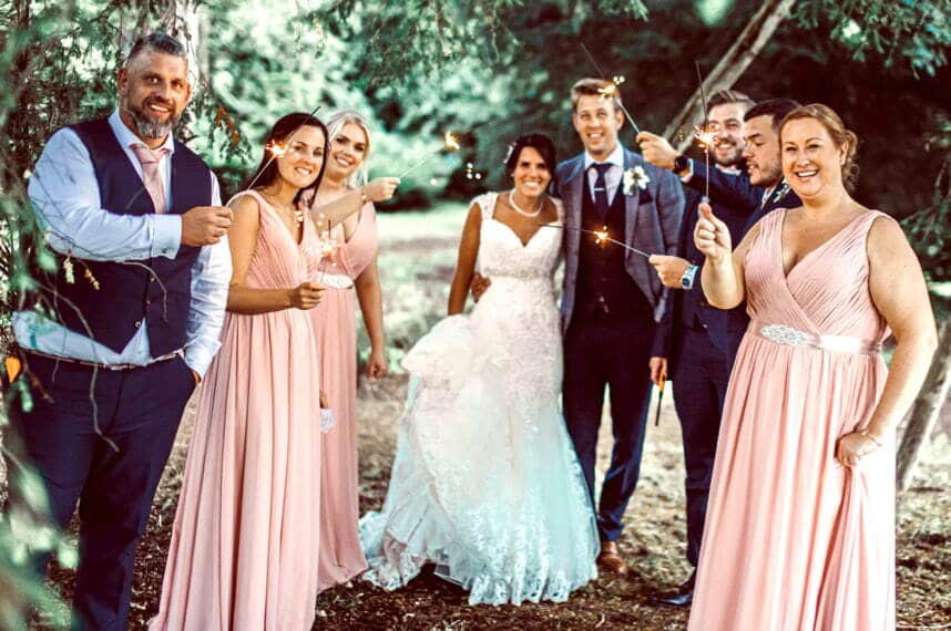 A group of individuals celebrating a wedding
